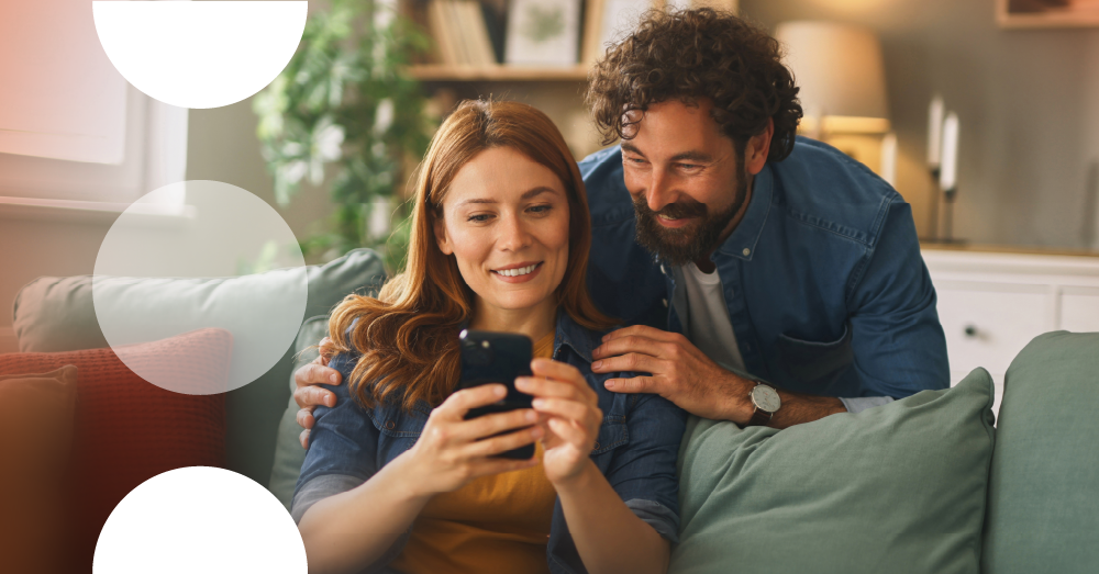 Photo of man and women sat on the couch